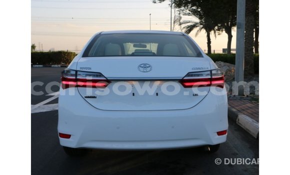 Sayi Imported Toyota Corolla White Mota in Import - Dubai a Benin Sayi Imported Toyota Corolla White Mota in Import - Dubai a Benin