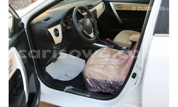 Sayi Imported Toyota Corolla White Mota in Import - Dubai a Benin Sayi Imported Toyota Corolla White Mota in Import - Dubai a Benin