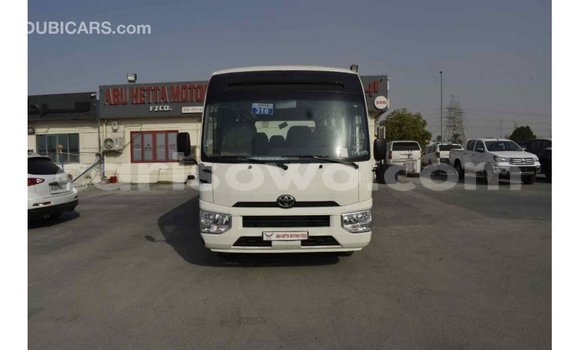 Sayi Imported Toyota Coaster White Babbar mota in Import - Dubai a Benin Sayi Imported Toyota Coaster White Babbar mota in Import - Dubai a Benin