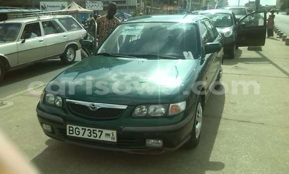 Sayi Na hannu Mazda 323 Green Mota in Cotonou a Benin