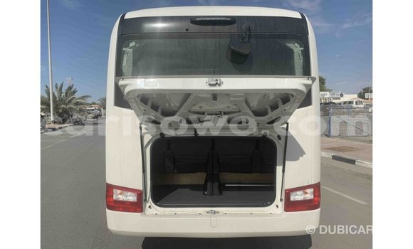 Sayi Imported Toyota Coaster White Babbar mota in Import - Dubai a Benin Sayi Imported Toyota Coaster White Babbar mota in Import - Dubai a Benin