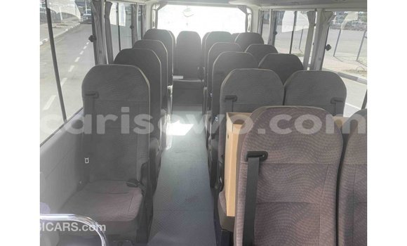 Sayi Imported Toyota Coaster White Babbar mota in Import - Dubai a Benin Sayi Imported Toyota Coaster White Babbar mota in Import - Dubai a Benin