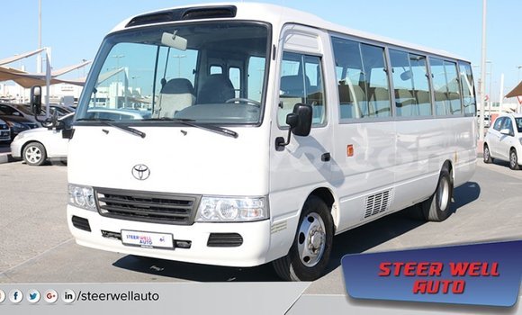 Sayi Imported Toyota Coaster White Babbar mota in Import - Dubai a Benin Sayi Imported Toyota Coaster White Babbar mota in Import - Dubai a Benin