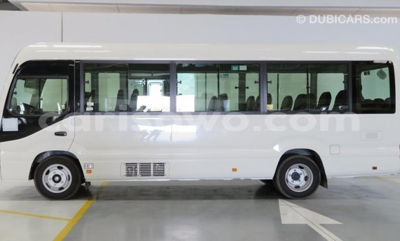 Sayi Imported Toyota Coaster White Babbar mota in Import - Dubai a Benin Sayi Imported Toyota Coaster White Babbar mota in Import - Dubai a Benin