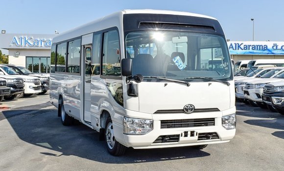 Sayi Imported Toyota Coaster White Babbar mota in Import - Dubai a Benin Sayi Imported Toyota Coaster White Babbar mota in Import - Dubai a Benin
