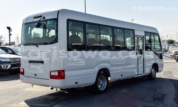 Sayi Imported Toyota Coaster White Babbar mota in Import - Dubai a Benin Sayi Imported Toyota Coaster White Babbar mota in Import - Dubai a Benin