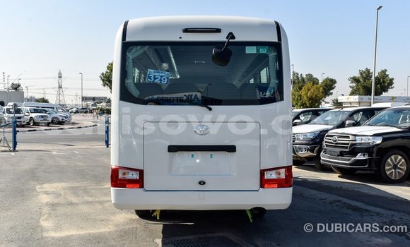 Sayi Imported Toyota Coaster White Babbar mota in Import - Dubai a Benin Sayi Imported Toyota Coaster White Babbar mota in Import - Dubai a Benin