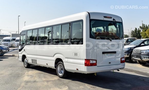 Sayi Imported Toyota Coaster White Babbar mota in Import - Dubai a Benin Sayi Imported Toyota Coaster White Babbar mota in Import - Dubai a Benin