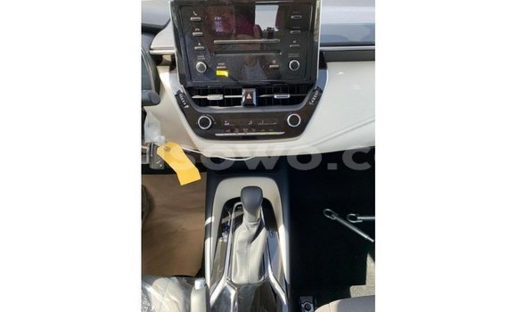 Acheter Import Voiture Toyota Corolla Blanc à Import - Dubai, Benin Acheter Import Voiture Toyota Corolla Blanc à Import - Dubai, Benin