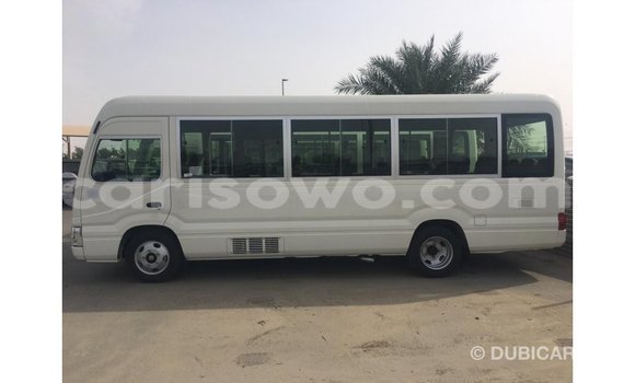 Sayi Imported Toyota Coaster White Babbar mota in Import - Dubai a Benin Sayi Imported Toyota Coaster White Babbar mota in Import - Dubai a Benin