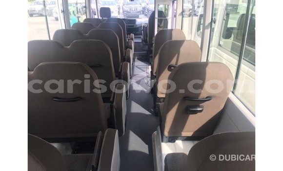 Sayi Imported Toyota Coaster White Babbar mota in Import - Dubai a Benin Sayi Imported Toyota Coaster White Babbar mota in Import - Dubai a Benin