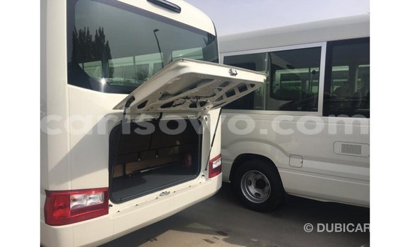 Sayi Imported Toyota Coaster White Babbar mota in Import - Dubai a Benin Sayi Imported Toyota Coaster White Babbar mota in Import - Dubai a Benin