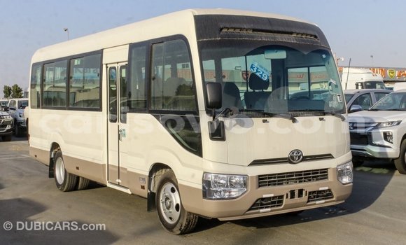 Sayi Imported Toyota Coaster White Babbar mota in Import - Dubai a Benin Sayi Imported Toyota Coaster White Babbar mota in Import - Dubai a Benin