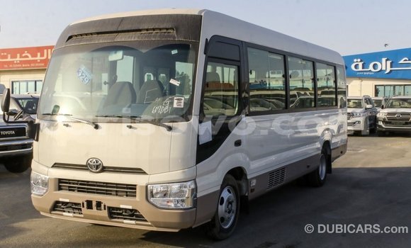 Sayi Imported Toyota Coaster White Babbar mota in Import - Dubai a Benin Sayi Imported Toyota Coaster White Babbar mota in Import - Dubai a Benin