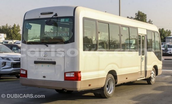 Sayi Imported Toyota Coaster White Babbar mota in Import - Dubai a Benin Sayi Imported Toyota Coaster White Babbar mota in Import - Dubai a Benin