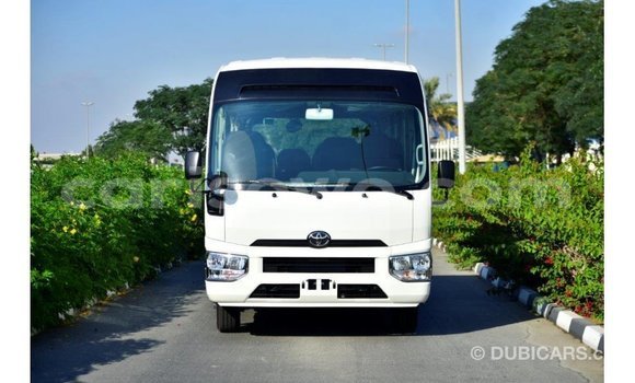 Acheter Import Utilitaire Toyota Coaster Blanc à Import - Dubai, Benin Acheter Import Utilitaire Toyota Coaster Blanc à Import - Dubai, Benin