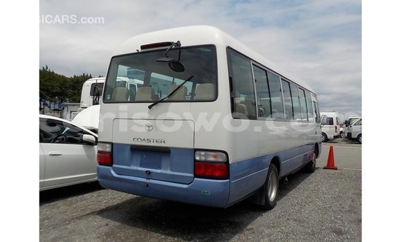 Sayi Imported Toyota Coaster White Babbar mota in Import - Dubai a Benin Sayi Imported Toyota Coaster White Babbar mota in Import - Dubai a Benin