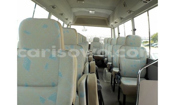 Sayi Imported Toyota Coaster White Babbar mota in Import - Dubai a Benin Sayi Imported Toyota Coaster White Babbar mota in Import - Dubai a Benin