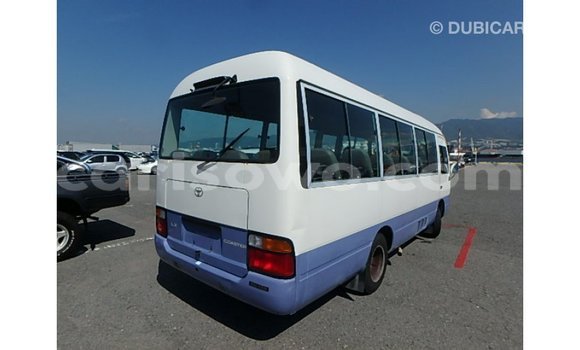 Sayi Imported Toyota Coaster White Babbar mota in Import - Dubai a Benin Sayi Imported Toyota Coaster White Babbar mota in Import - Dubai a Benin