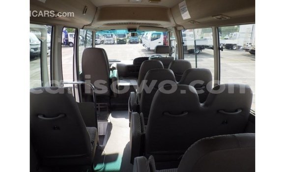 Sayi Imported Toyota Coaster White Babbar mota in Import - Dubai a Benin Sayi Imported Toyota Coaster White Babbar mota in Import - Dubai a Benin