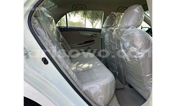 Sayi Imported Toyota Corolla White Mota in Import - Dubai a Benin Sayi Imported Toyota Corolla White Mota in Import - Dubai a Benin