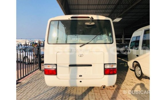Acheter Import Utilitaire Toyota Coaster Blanc à Import - Dubai, Benin Acheter Import Utilitaire Toyota Coaster Blanc à Import - Dubai, Benin