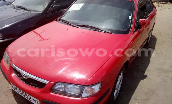 Acheter Occasion Voiture Mazda 323 Rouge à Cotonou, Benin Acheter Occasion Voiture Mazda 323 Rouge à Cotonou, Benin