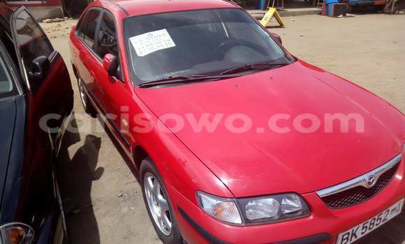 Acheter Occasion Voiture Mazda 323 Rouge à Cotonou, Benin Acheter Occasion Voiture Mazda 323 Rouge à Cotonou, Benin